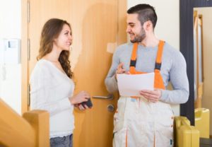 Vigilant Woman Talking To Hvac Professional Shutterstock 272900732